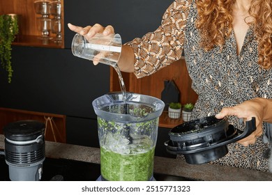 Ingredients including mint, lemon, and sugar being added to a blender for a fresh and healthy drink. - Powered by Shutterstock