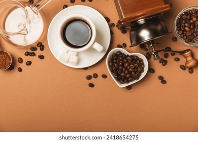 Ingredients for making coffee. Moka pot, Turkish coffee pots (cezve), coffee grinder with coffee beans, milk, sugar and spices on a brown background. Drink preparation concept. Flat Lay.Copy space. - Powered by Shutterstock