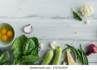 Ingredients For Making Healthy Vegan Food. Cauliflower, Zucchini, Red Onion, Green Beans, Eggs, Cheese And Spinach Leaves For Making Veggie Frittata. Clean Eating, Vegetarian Food Concept