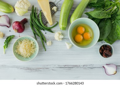 Ingredients For Making Healthy Vegan Food. Cauliflower, Zucchini, Red Onion, Green Beans, Eggs, Cheese And Spinach Leaves For Making Veggie Frittata. Clean Eating, Vegetarian Food Concept