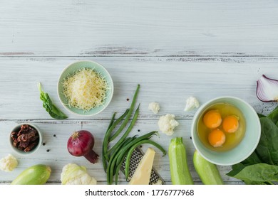 Ingredients For Making Healthy Vegan Food. Cauliflower, Zucchini, Red Onion, Green Beans, Eggs, Cheese And Spinach Leaves For Making Veggie Frittata. Clean Eating, Vegetarian Food Concept