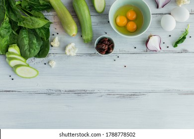 Ingredients For Making Healthy Vegan Food. Cauliflower, Zucchini, Red Onion, Green Beans, Eggs And Green Spinach Leaves For Making Veggie Frittata. Clean Eating, Vegetarian Food Concept