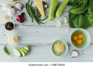 Ingredients For Making Healthy Vegan Food. Cauliflower, Zucchini, Red Onion, Green Beans, Eggs, Cheese And Spinach Leaves For Making Veggie Frittata. Clean Eating, Vegetarian Food Concept