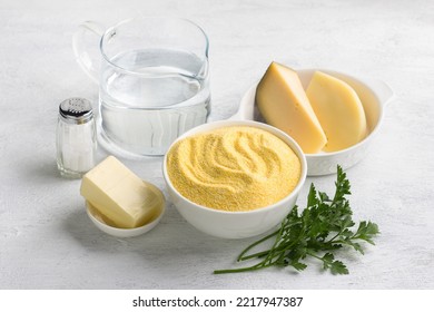 Ingredients For Making Italian Polenta With Cheese: Corn Grits, Two Types Of Cheese, Butter, Salt And Water. Cooking Delicious Homemade Vegetarian Food