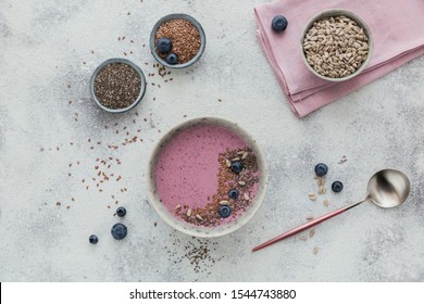 Ingredients For Making Pink Yogurt Smoothie Bowl With Fresh Blueberry And Seeds. Flat Lay