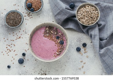 Ingredients For Making Pink Yogurt Smoothie Bowl With Fresh Blueberry And Seeds. Top View