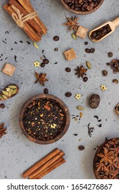 Ingredients For Making Spicy Indian Masala Chai Tea Or Coffee. Dried Black Tea, Roasted Coffee Beans, Dry Anise Star Seeds, Cinnamon Sticks, Cardamom, Black Pepper And Brown Sugar.