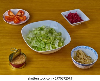 Ingredients For Making Tuna And Green Vegan Salad On A Wooden Background.