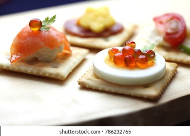 Canapés With Ingredients On Crackers