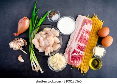 Ingredients For Pasta Carbonara With Pan Seared Scallops: Overhead View Of Raw Scallops, Linguine Noodles, Bacon, And Other Ingredients