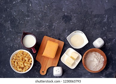 Ingredients For The Preparation Of Mac And Cheese: Dry Pasta, Orange Cheddar Cheese, Wheat Flour, Bread Crumbs, Milk, Butter, Salt, Pepper