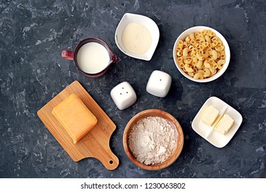 Ingredients For The Preparation Of Mac And Cheese: Dry Pasta, Orange Cheddar Cheese, Wheat Flour, Bread Crumbs, Milk, Butter, Salt, Pepper