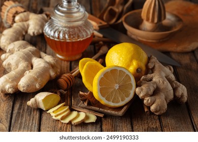 Ingredients for preparing ginger tea. Ginger, lemon, honey, anise, and cinnamon sticks on a old kitchen table. - Powered by Shutterstock