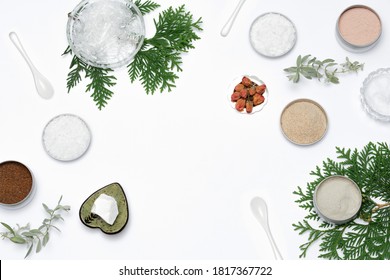 Ingredients For The Production Of Cosmetics On A White Background. Clays, Wax, Herbal Powders, Dried Flowers, Raspberry Ketone, Menthol Crystals. Natural Cosmetics Concept.