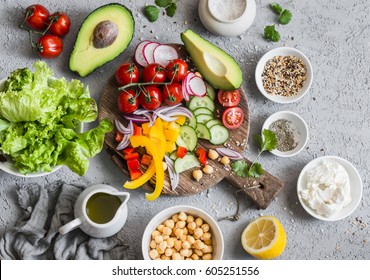 Ingredients for spring vegetable buddha bowl. Delicious healthy food.  On a gray background, top view     - Shutterstock ID 605251556