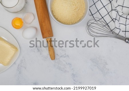 Ingredients and tools for baking, flat lay on marble table