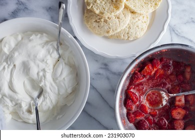 The ingredients used to make a strawberry shortcake stack. 