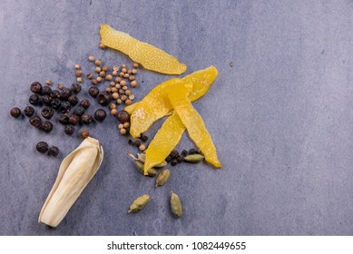 Ingredients Used In The Making Of Gin On A Blue Stone Background. 