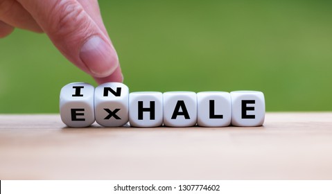 Inhale,Exhale Concept. Hand Turns Dice And Changes The Word 