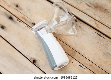 
Inhaler, White Portable Nebulizer On A Table