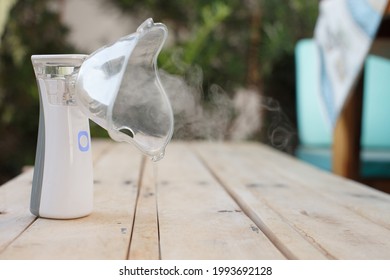 
Inhaler, White Portable Nebulizer On A Table