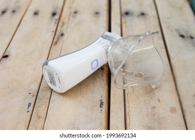 
Inhaler, White Portable Nebulizer On A Table