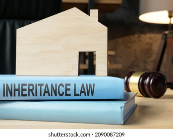 Inheritance Law Book And Model Of House.