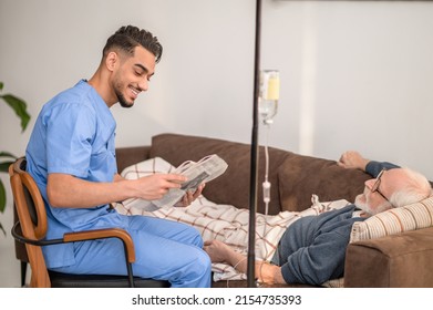 In-home Nurse Entertaining A Patient On The IV Drip