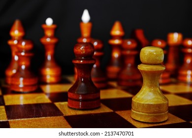 Initial Pawn Moves In The Debut Of A Chess Game Close Up On Black Background And Blurred Line Black Pieces