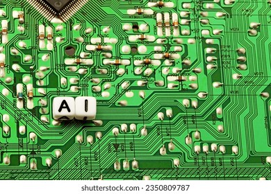 Initials of the word artificial intelligence on an integrated circuit board and microchips