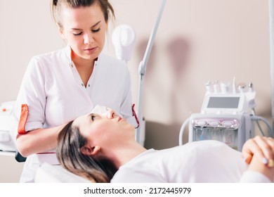 Injectable tissue stimulator on woman face in beauty salon. Aesthetic medicine - Shutterstock ID 2172445979