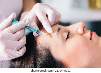 Injectable tissue stimulator on woman face in beauty salon. Aesthetic medicine - Shutterstock ID 2172446011