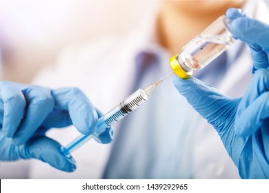 injecting injection vaccine vaccination medicine flu man doctor insulin health drug influenza concept - stock image