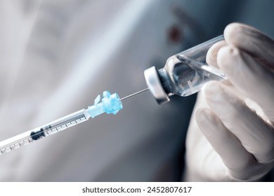 injecting injection vaccine vaccination medicine into a syringe woman nurse - Powered by Shutterstock