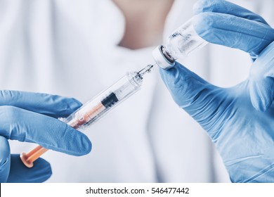 injecting injection vaccine vaccination medicine flu man doctor insulin health drug influenza concept - stock image