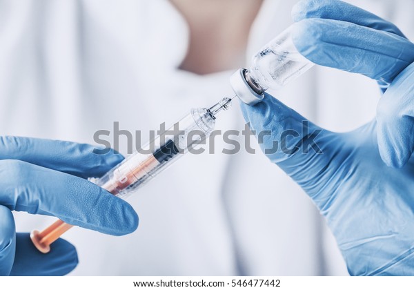 injecting\
injection vaccine vaccination medicine flu man doctor insulin\
health drug influenza concept - stock\
image