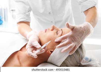 Injection of botox.Cosmetic been injected woman's face