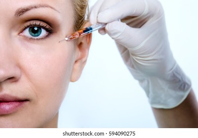 Injection for the rejuvenation of the skin around the eyes.