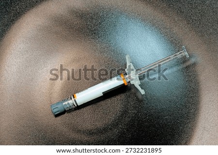 injection solution, syringe and needle