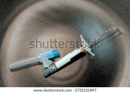 injection solution, syringe and needle