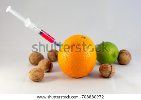 Injection with a syringe into the fruit