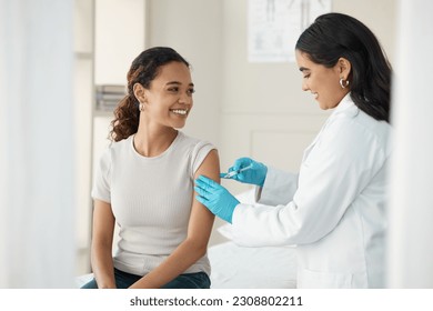 Injection, vaccine and patient at the clinic for consulting and help with prevention with a smile. Doctor, inject and woman on arm for virus with gloves in medical room for wellness or health. - Powered by Shutterstock