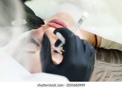 Injections of the lips. Adjustment of the lower lip form. Injection of beauty. Spa. Facial Rejuvenation. Lip augmentation