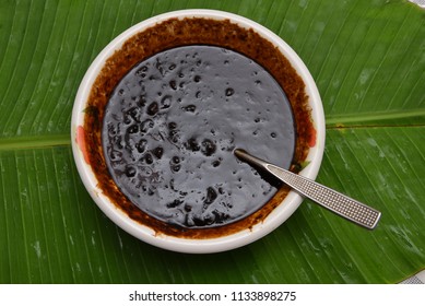 Injipuli or Puli Inji is sweet and sour Kerala cuisine. Dark brown ginger pickle made of ginger, tamarind, green chillies and jaggery in Tamil Nadu, Kerala in South India served for Onam Sadhya. 