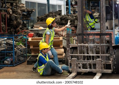 Injured Asian Man Worker After Accident In A Old Car Parts Warehouse.  Forklift Crash Leg Worker Accident