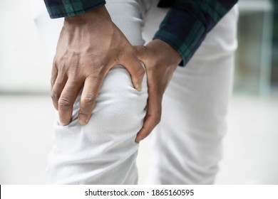 Injured black African man suffered from knee joint pain, osteoarthritis
