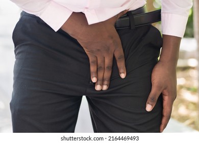 Injured Black African Man Suffering From Pelvic Pain Or Hip Joint Injury