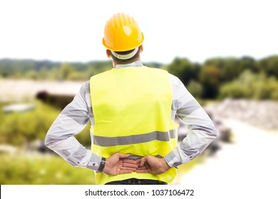 Injured Construction Worker Or Engineer Suffering Backpain In Lower Back Area Outdoor At Work