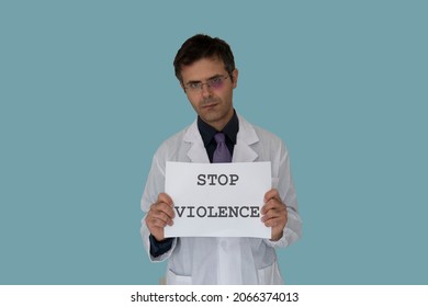 Injured Doctor With Stop Violence Sign. Concept Of Violence And Aggression On Doctors And Healthcare Professionals