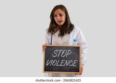 Injured Female Doctor With Stop Violence Sign. Concept Of Violence And Aggression On Doctors And Healthcare Professionals